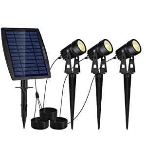 Three LED solar spotlights with a black finish, designed for outdoor use, showcasing their waterproof features and bright warm white light.