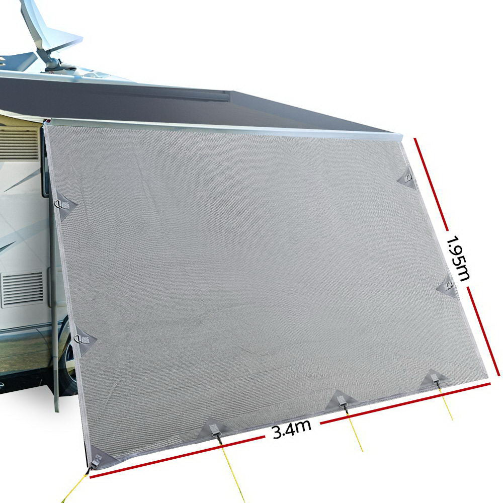 3.4M Caravan Privacy Screen attached to a caravan awning, showcasing its grey water-repellent fabric and stainless steel D-rings.