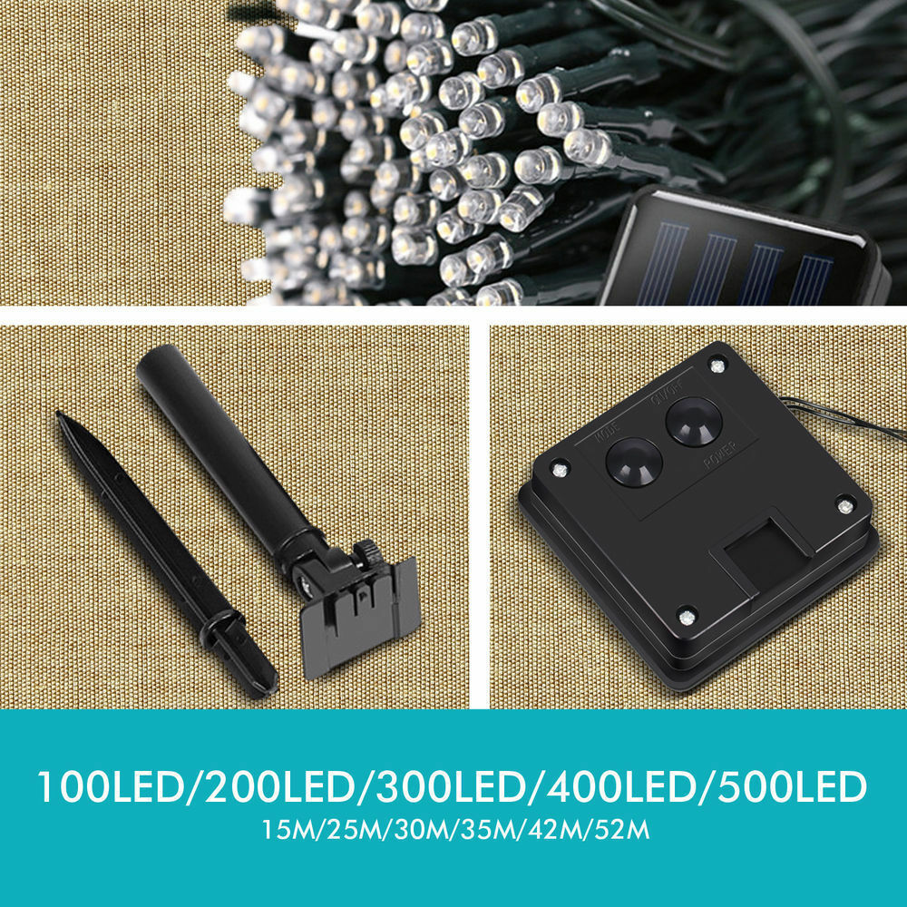 A 35M string of 200LED solar-powered fairy lights glowing in a garden setting, perfect for Christmas and outdoor decor.