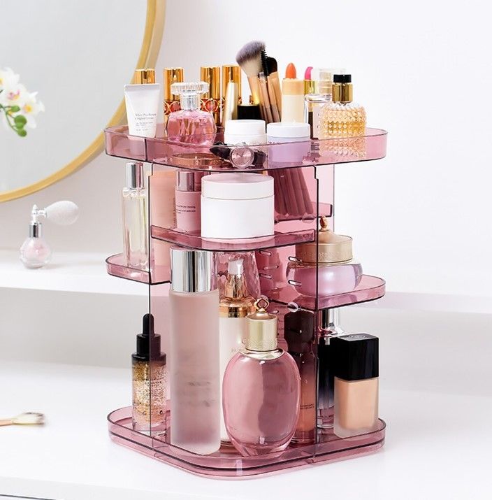 360 Rotating Large Capacity Makeup Organizer in pink, showcasing adjustable trays and a sleek design for cosmetics storage.