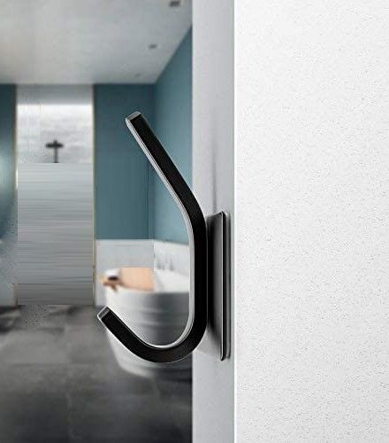 Four strong self-adhesive hooks in matte black, ideal for kitchen and bathroom use, showcasing their durable stainless steel construction.