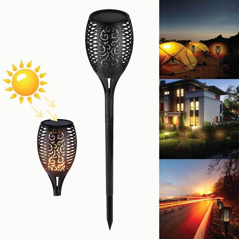 Four solar garden LED torches with flickering flame effect, perfect for outdoor ambiance lighting.