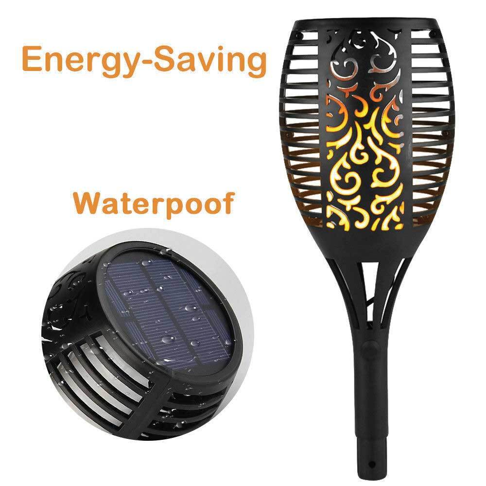 Four solar garden LED torches with flickering flame effect, perfect for outdoor ambiance lighting.