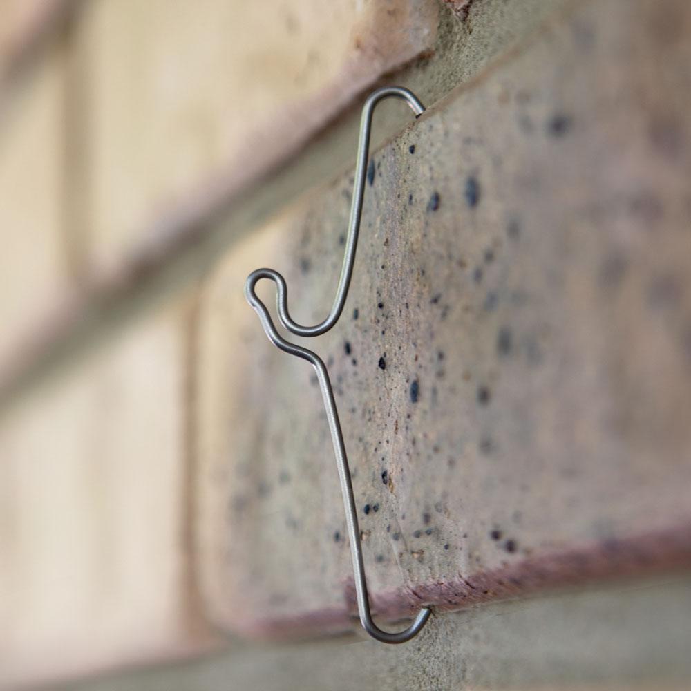 Five 120mm stainless steel brick hooks designed for hanging pictures and decorations on brick walls without damage.