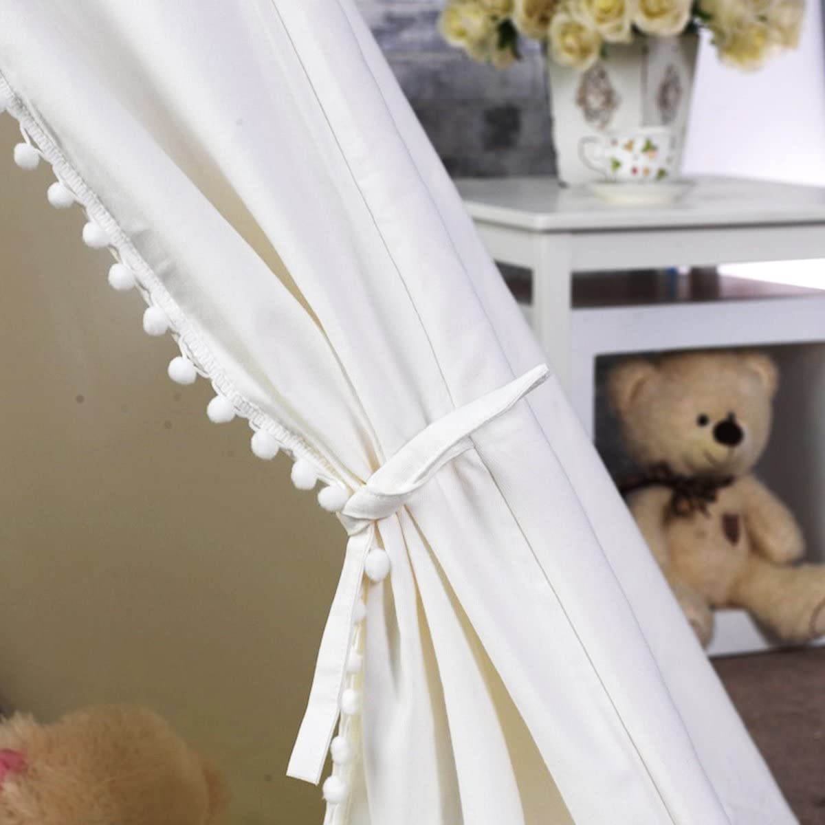 A spacious 5 Poles Giant Kids Teepee Tent made of natural cotton canvas, featuring wooden poles and a mesh window, perfect for children's play.