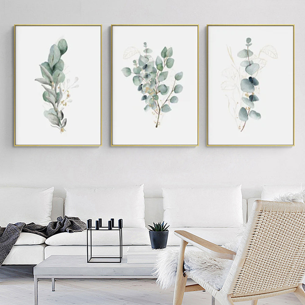 Three sets of 50cmx70cm eucalyptus plant canvas wall art framed in elegant gold frames, showcasing vibrant colors and a floating effect.