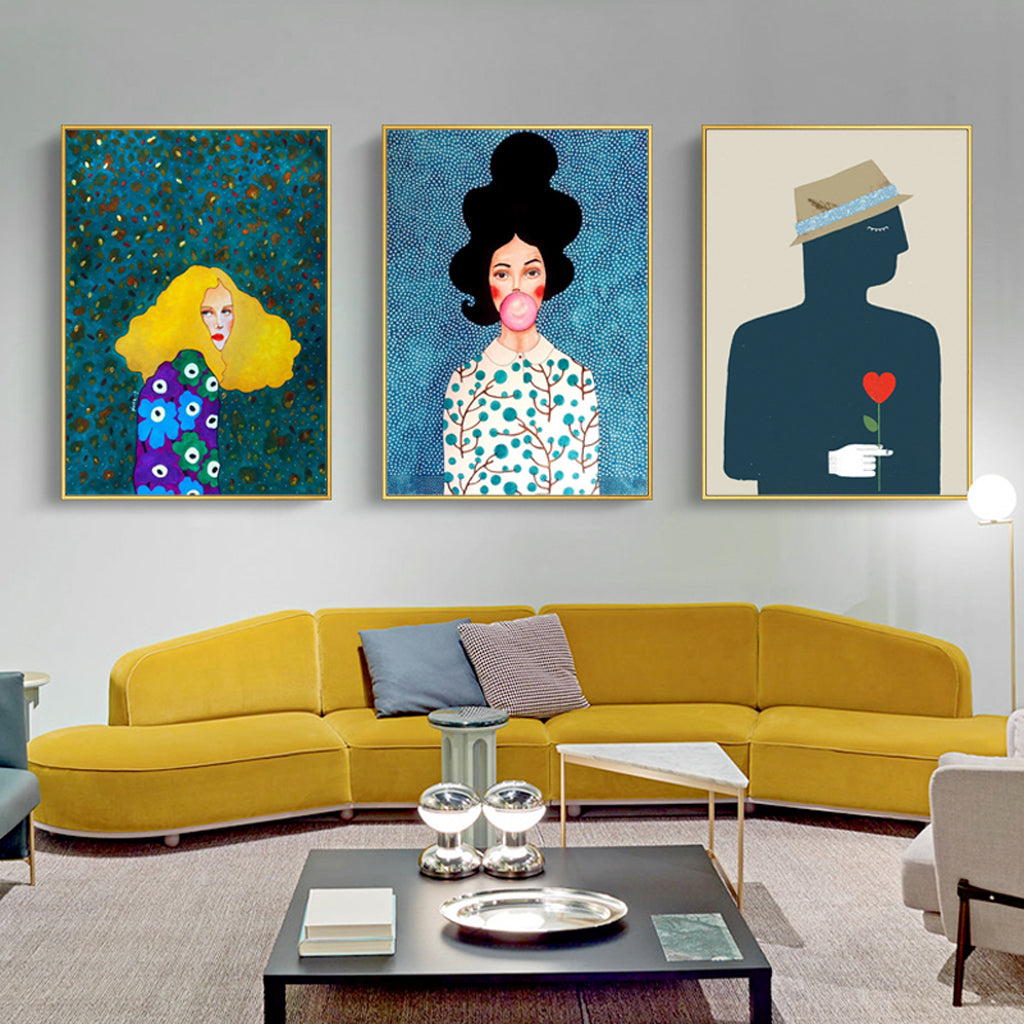 Three modern figure canvas wall art pieces in elegant gold frames, showcasing vibrant colors and a unique floating effect.
