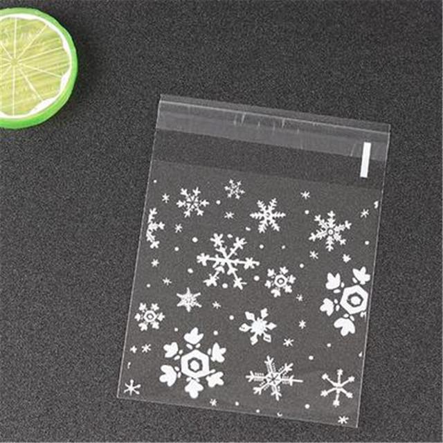A vibrant set of 50 plastic snowflake decorations in various sizes, perfect for Christmas and festive occasions.