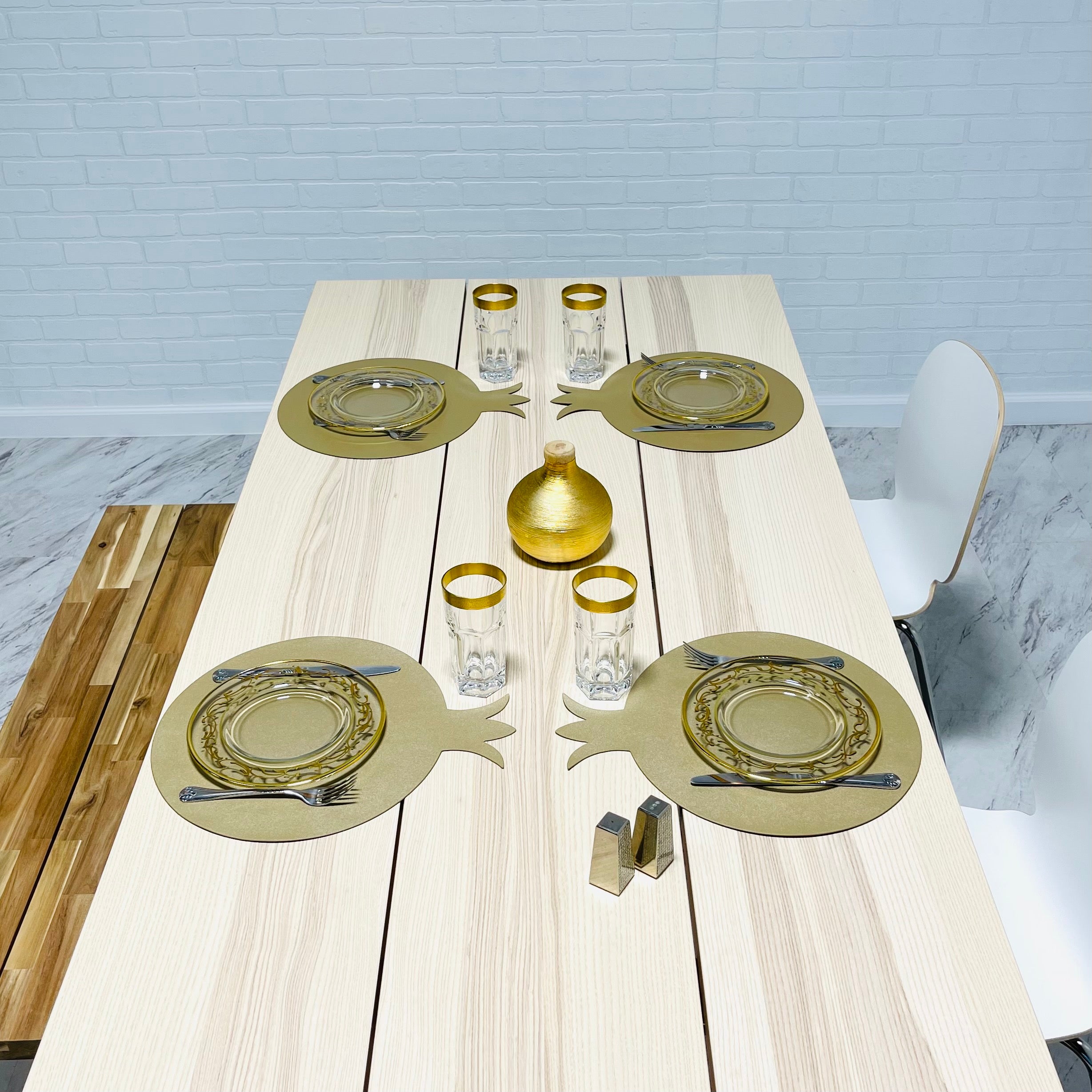 A set of six pomegranate-shaped placemats made from smooth faux leather in vibrant colors, perfect for festive dining.