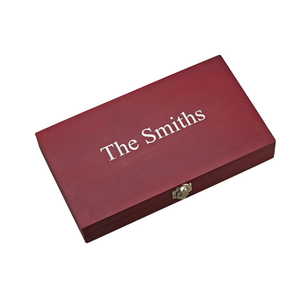 A 6 Piece Steak Knife Set displayed in a hinged rosewood case, showcasing stainless steel serrated knives.