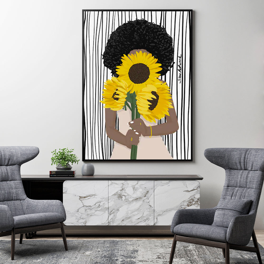 60cmx90cm canvas wall art featuring an African woman surrounded by sunflowers, framed in a sleek black frame.