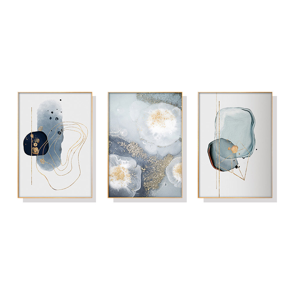 Three sets of marbled light grey canvas wall art framed in elegant gold frames, showcasing a modern design.