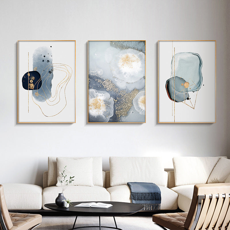 Three sets of marbled light grey canvas wall art framed in elegant gold frames, showcasing a modern design.
