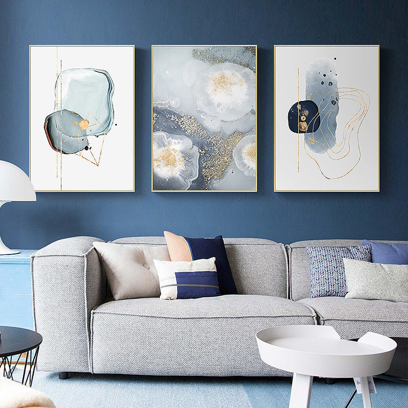 Three sets of marbled light grey canvas wall art framed in elegant gold frames, showcasing a modern design.