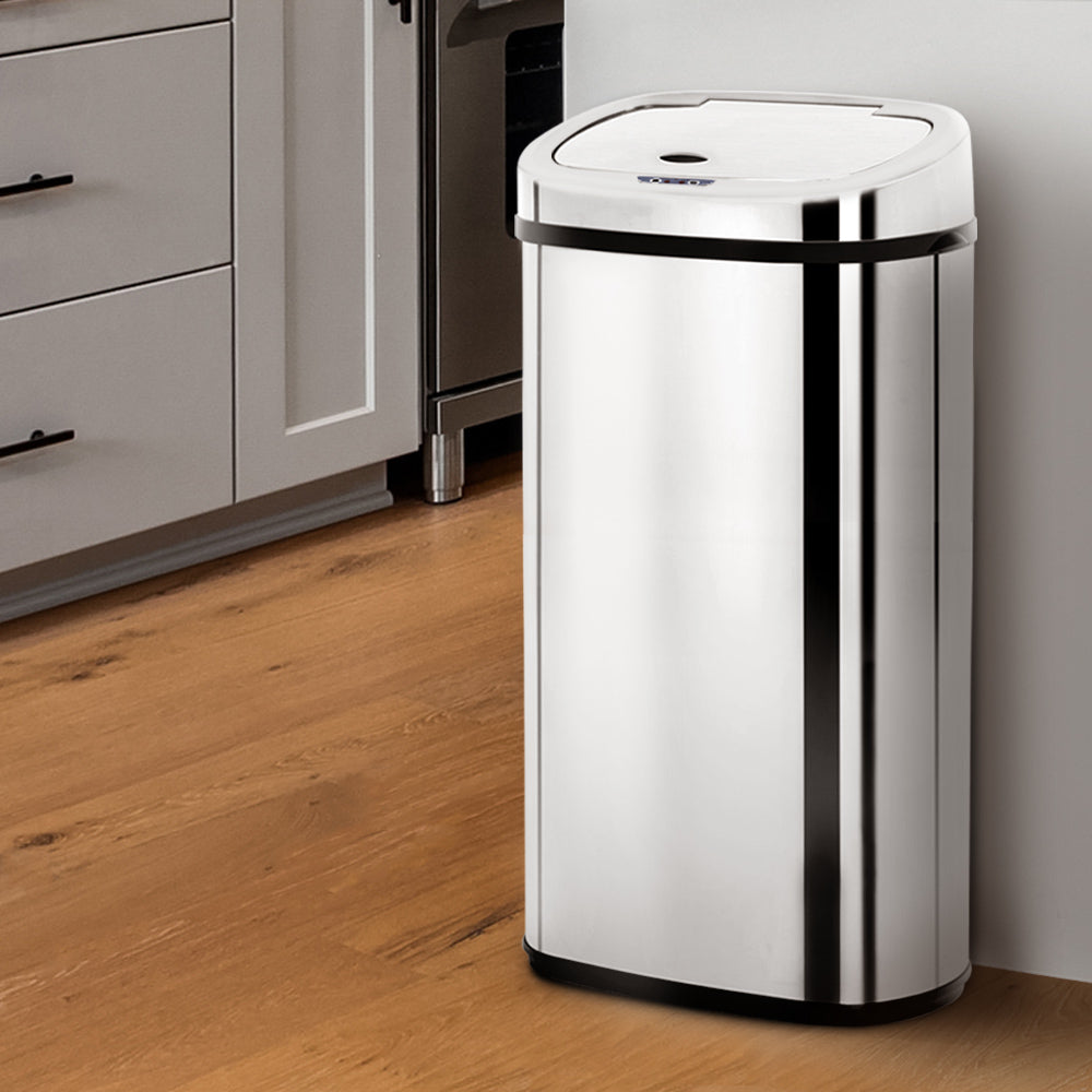 A sleek 68L stainless steel motion sensor rubbish bin with a hands-free lid, ideal for modern kitchens.