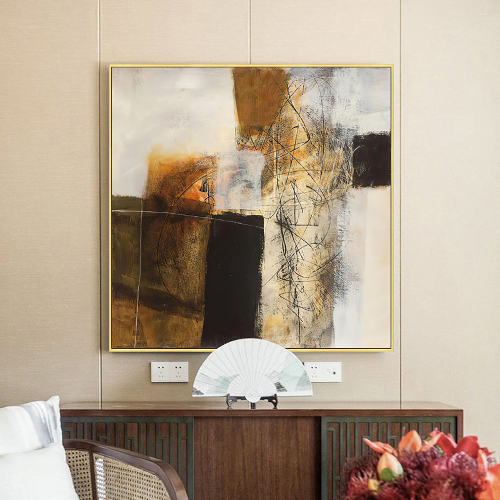A 70cmx70cm abstract painting featuring gold and brown tones, elegantly framed in a luxurious gold frame, ready to enhance any wall.