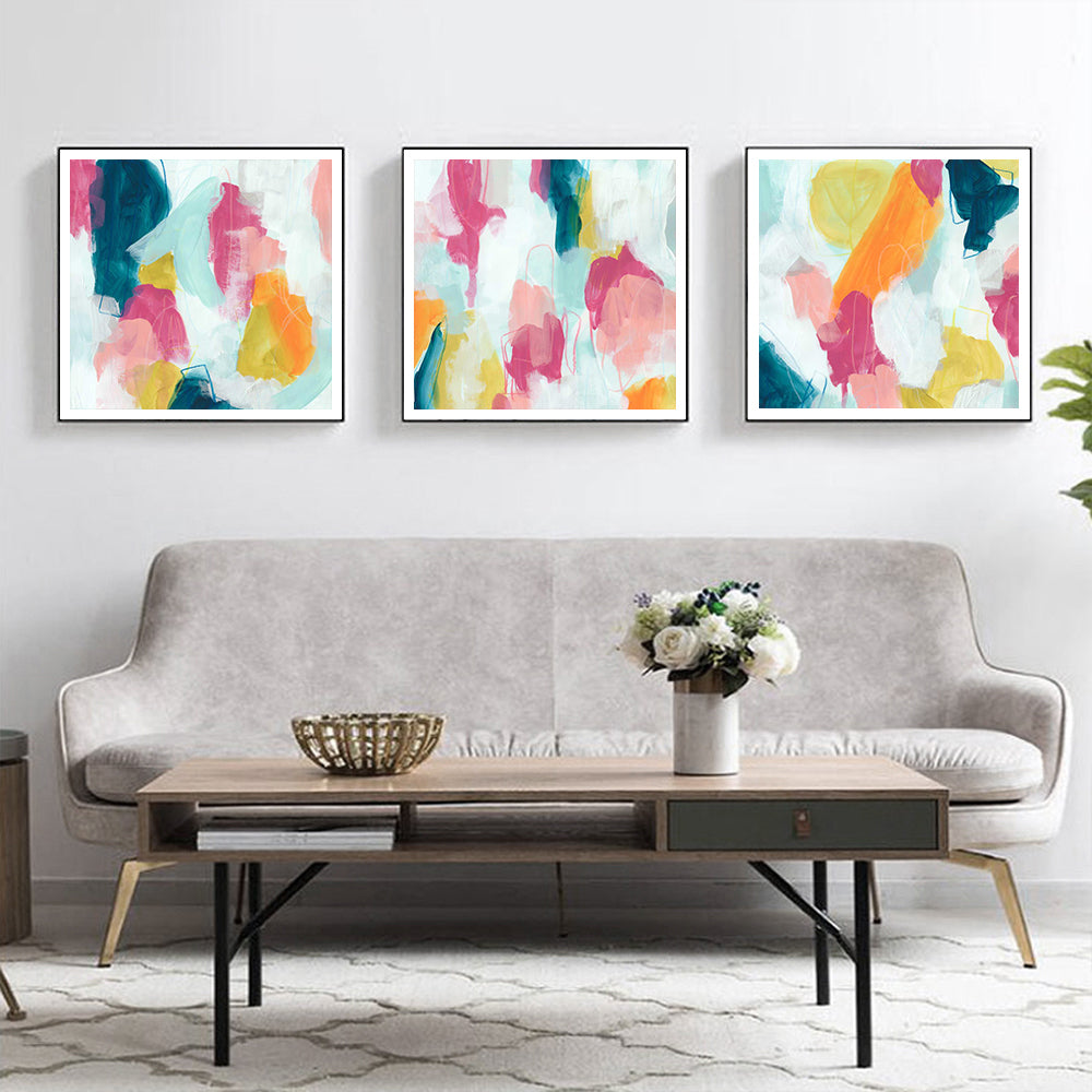 Three vibrant 70cmx70cm canvas wall art pieces in black frames, showcasing colorful designs, ready to enhance any living space.