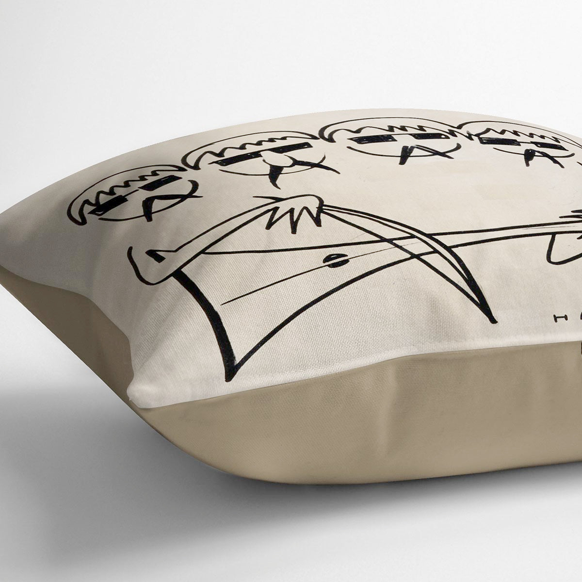 A vibrant Beatles Cartoon by Haro Cushion featuring colorful abstract designs on luxurious vegan faux suede.