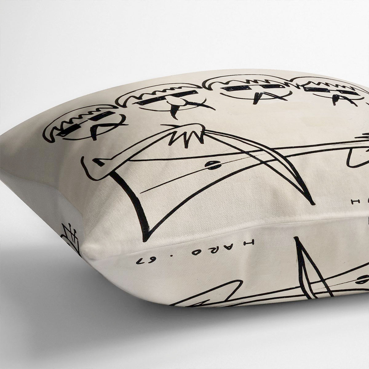 A vibrant Beatles Cartoon by Haro Cushion featuring colorful abstract designs on luxurious vegan faux suede.