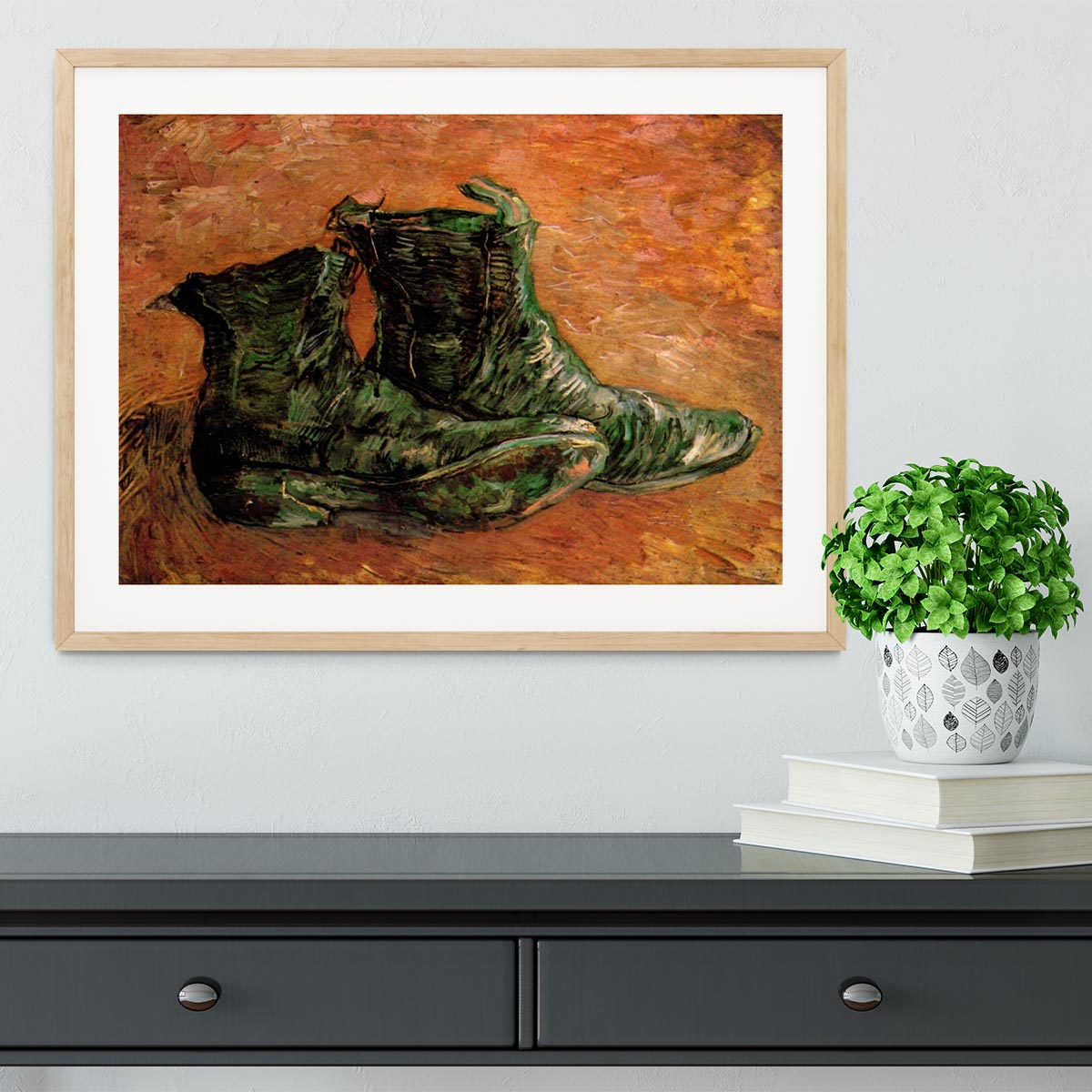Framed print of Van Gogh's iconic shoes, showcasing vibrant colors and intricate details.
