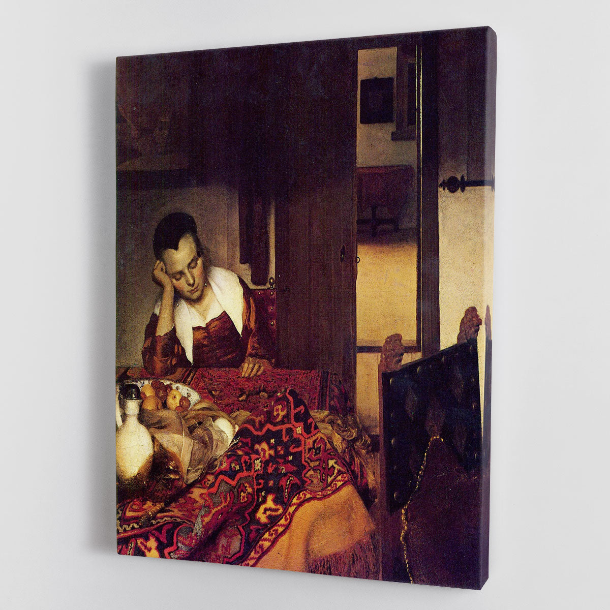 Canvas print of 'A Woman Asleep' by Vermeer, showcasing a serene woman in a peaceful slumber, with soft colors and intricate details.