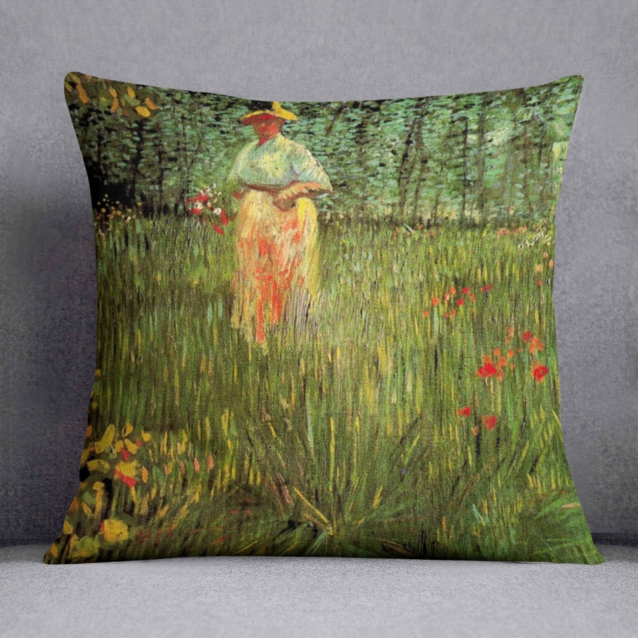 A plush cushion featuring Van Gogh's painting of a woman walking in a garden, showcasing vibrant colors and intricate details.