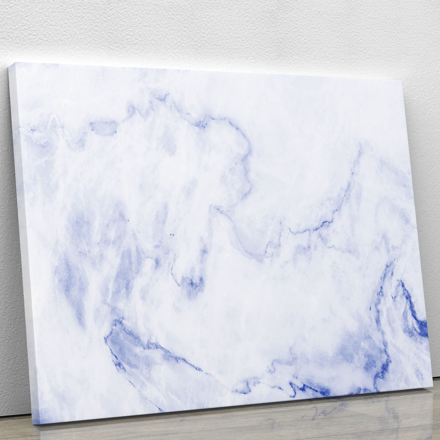 Abstract blue marble patterned canvas print showcasing elegant swirls and textures in vibrant blue tones.