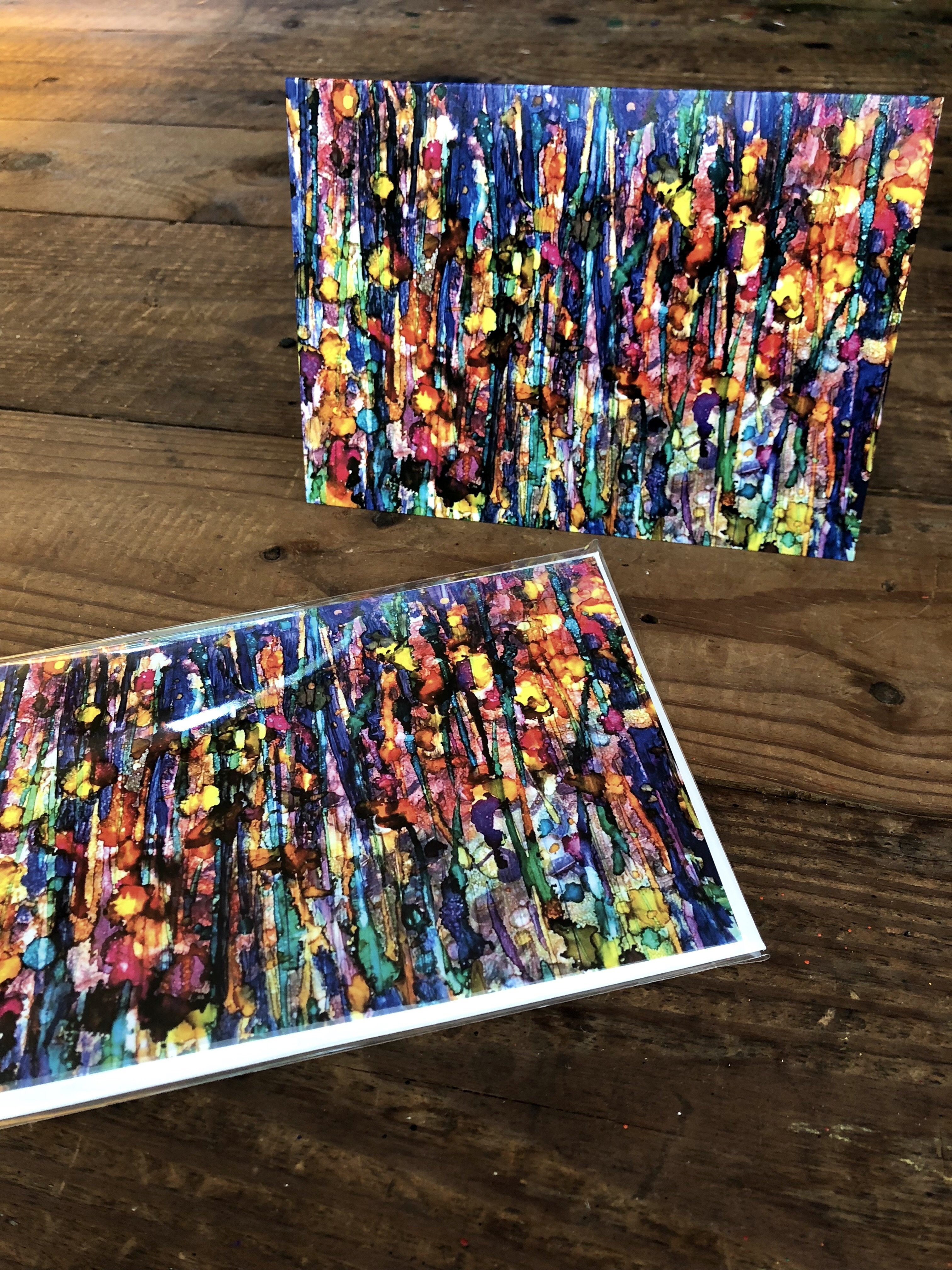 A vibrant abstract landscape painting titled Abstract Forest, featuring intricate details and soothing colors created with alcohol inks.