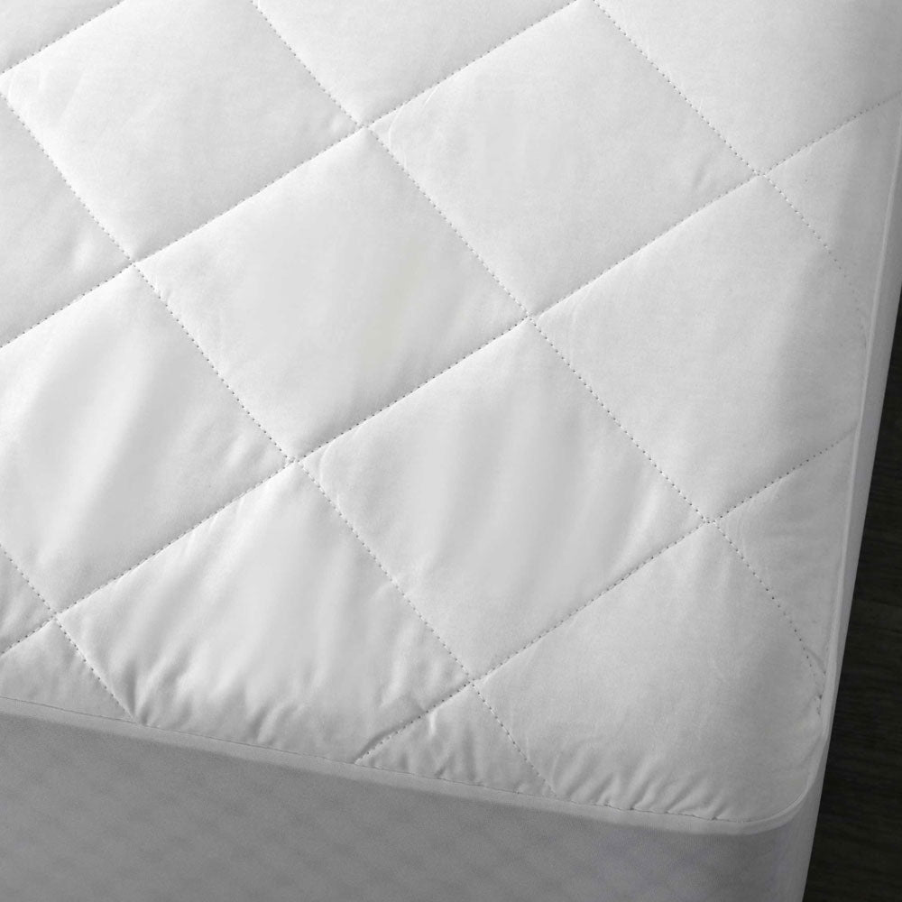 Accessorize Cotton Quilted Mattress Protector Single with quilted diamond design, showcasing its soft and breathable cotton fabric.