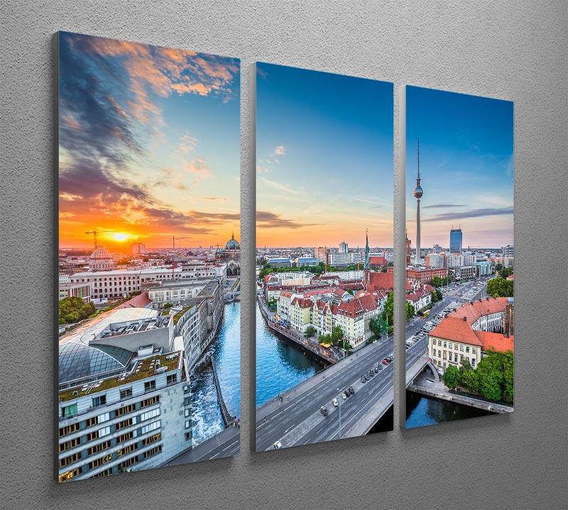Aerial view of Berlin skyline depicted in a stunning 3-panel canvas print, showcasing iconic buildings and vibrant city life.