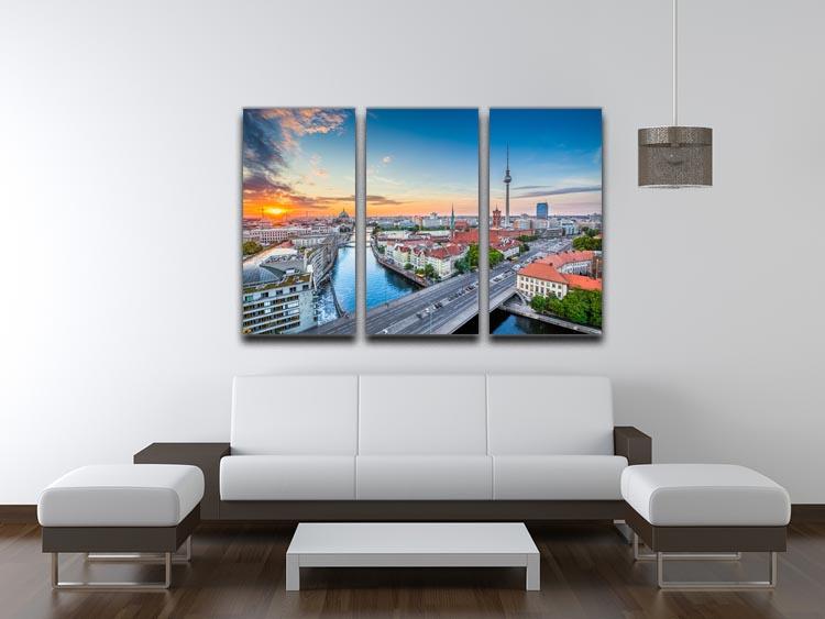 Aerial view of Berlin skyline depicted in a stunning 3-panel canvas print, showcasing iconic buildings and vibrant city life.