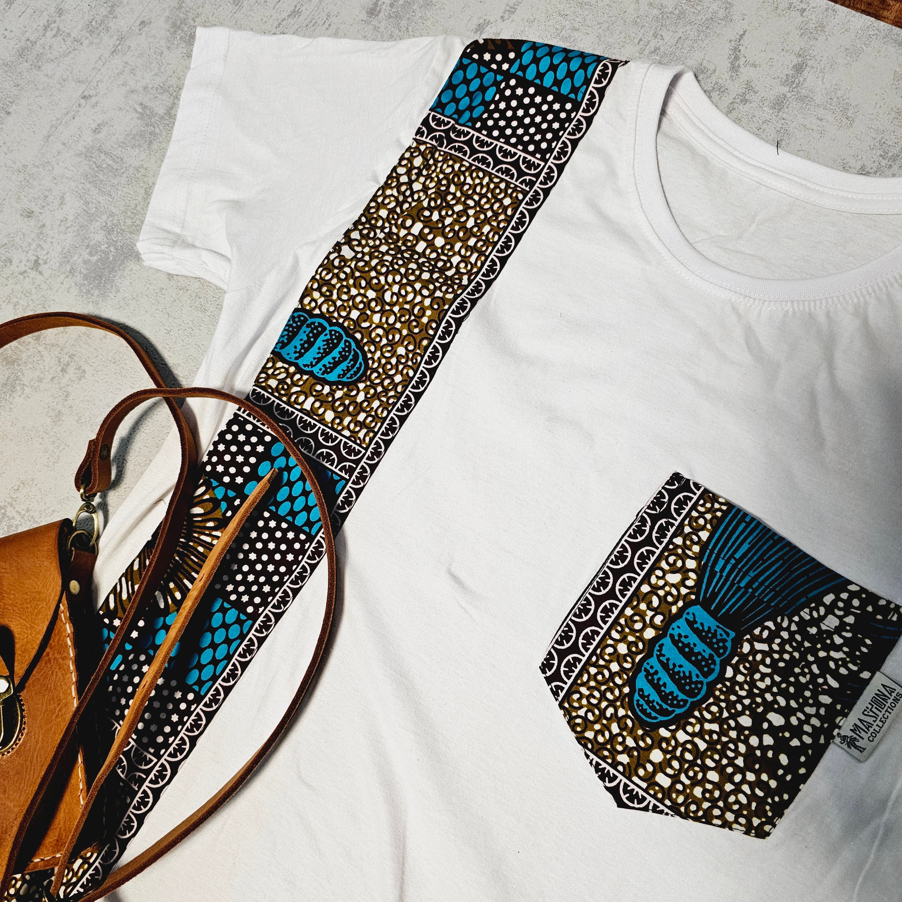 Africa Print Detailed T-Shirt featuring Ankara design and pocket, made from soft cotton jersey, ideal for casual wear.