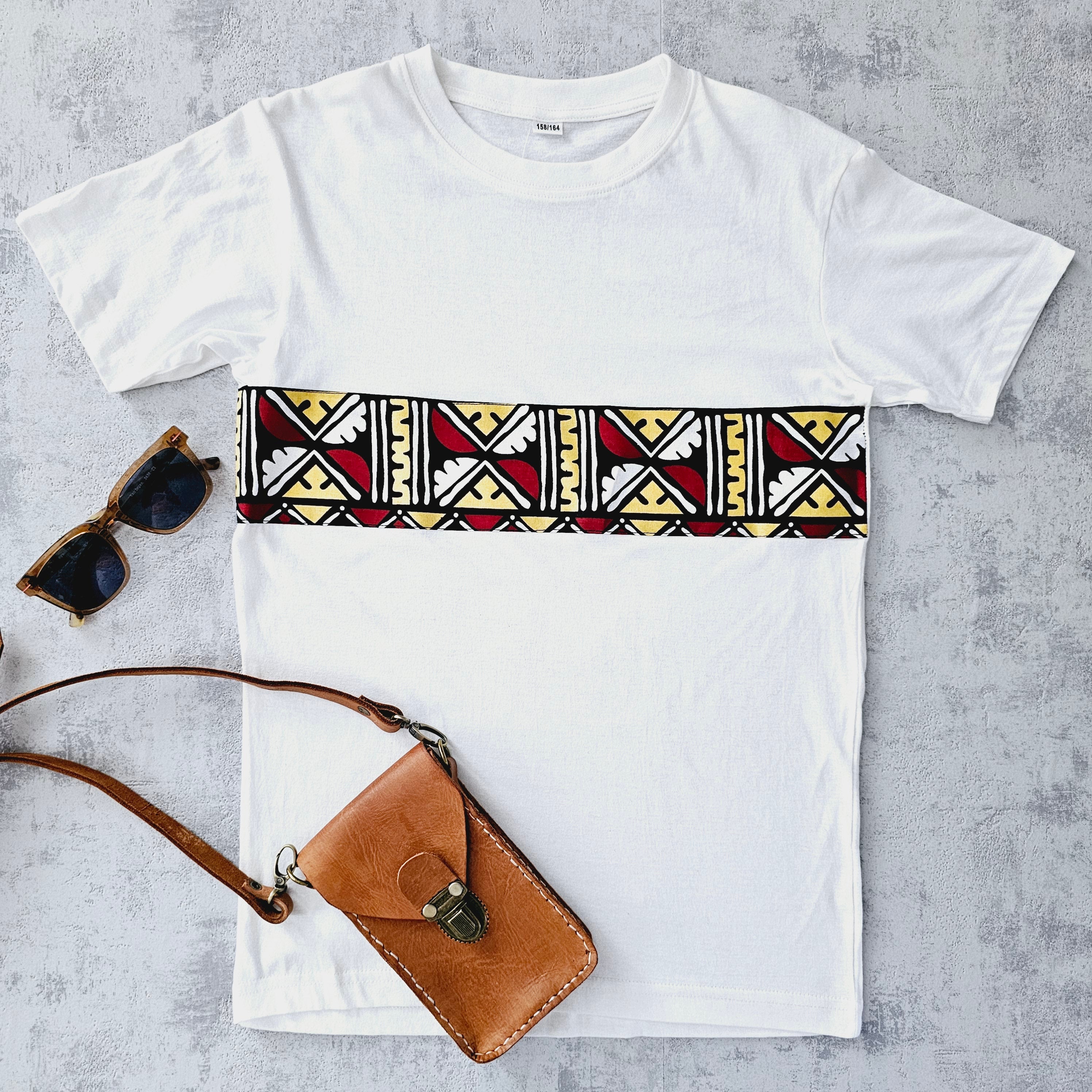 Africa Print Detailed T-Shirt featuring Ankara design and pocket, made from soft cotton jersey.