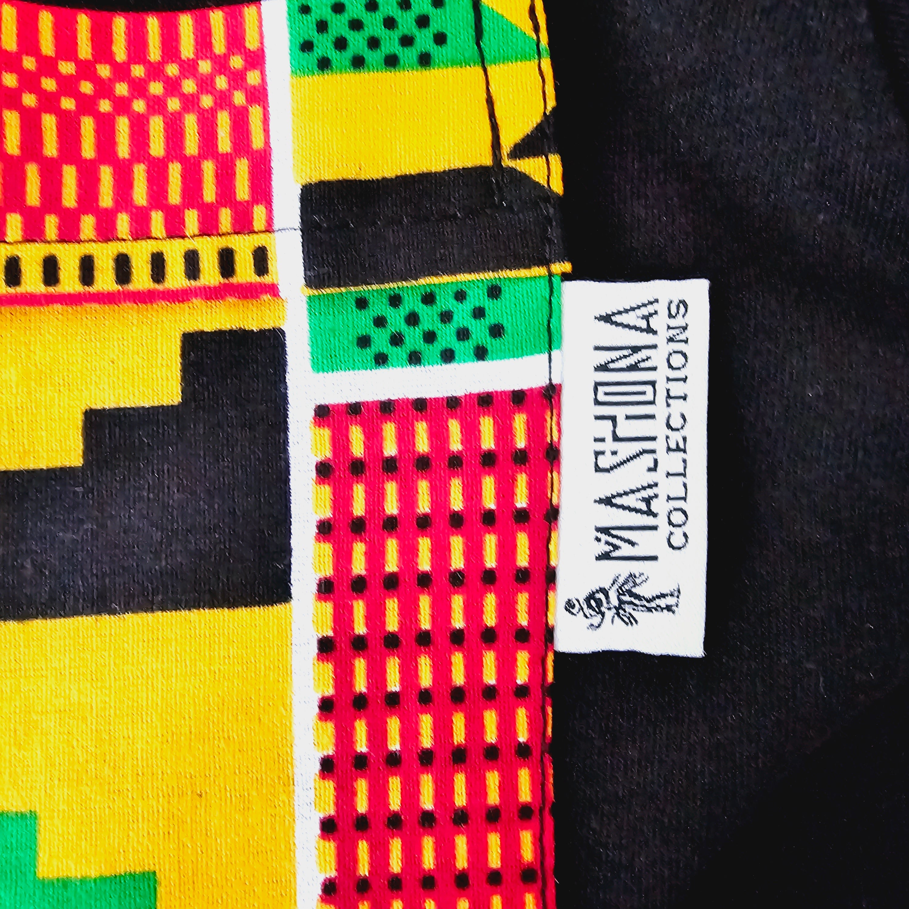 Africa Print Detailed T-Shirt featuring a black base with vibrant African print details and a pocket, showcasing a casual yet stylish design.
