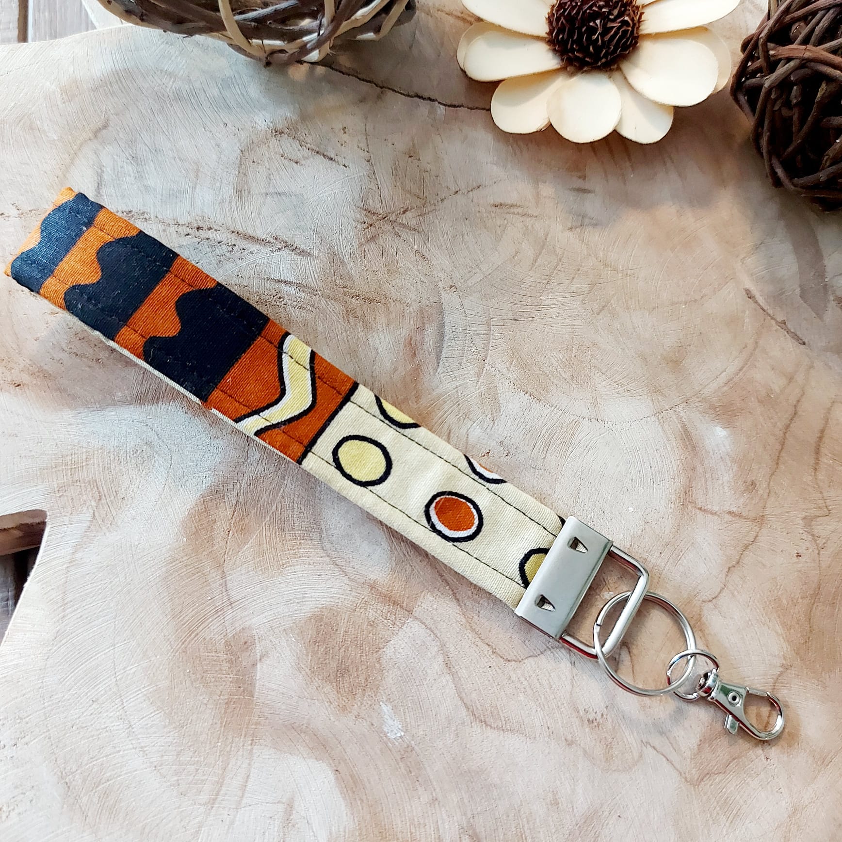 African Print and Leather Key Fob wristlet key holder featuring vibrant patterns and vegan leather lining.