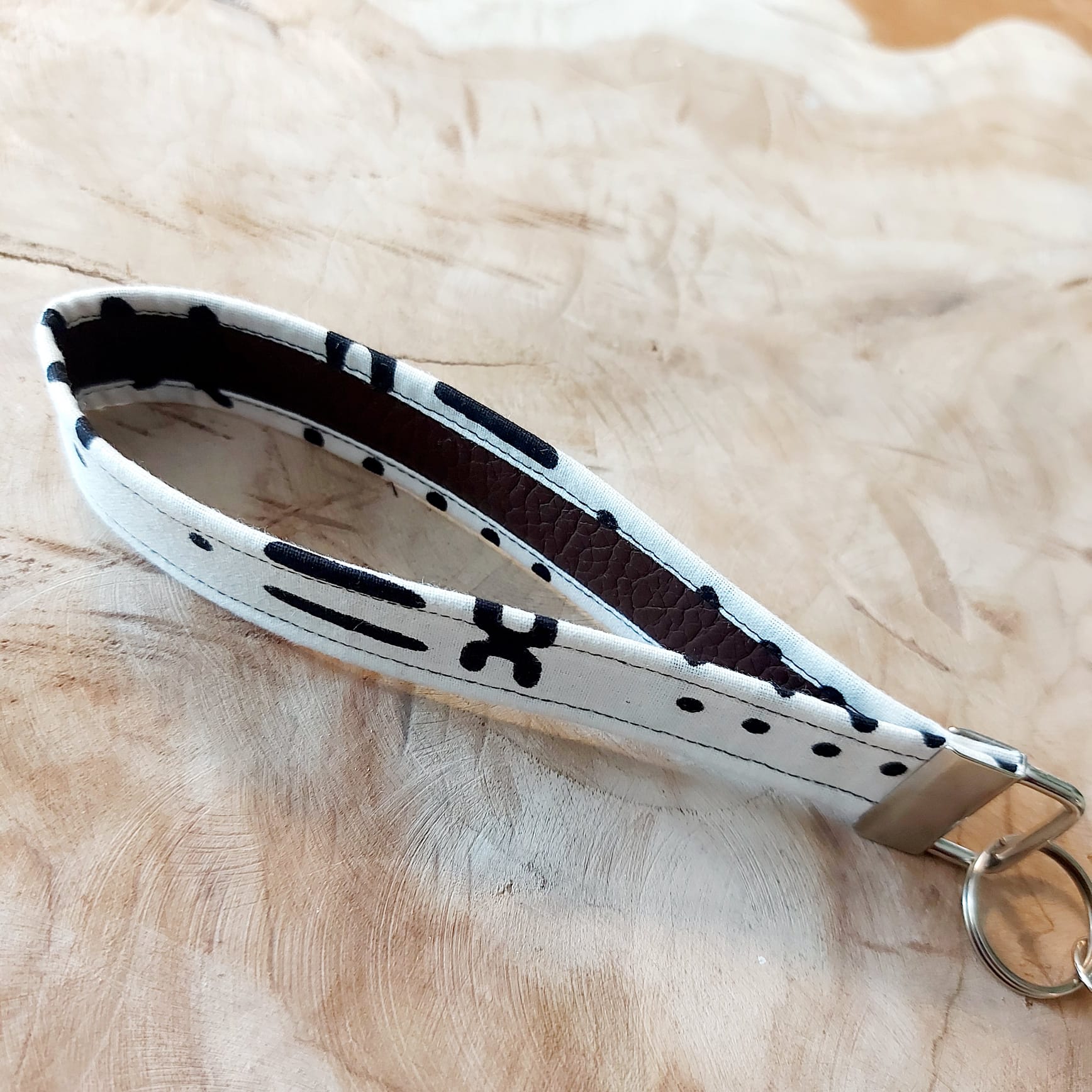 African Print and Leather Key Fob wristlet key holder featuring vibrant patterns and vegan leather lining.