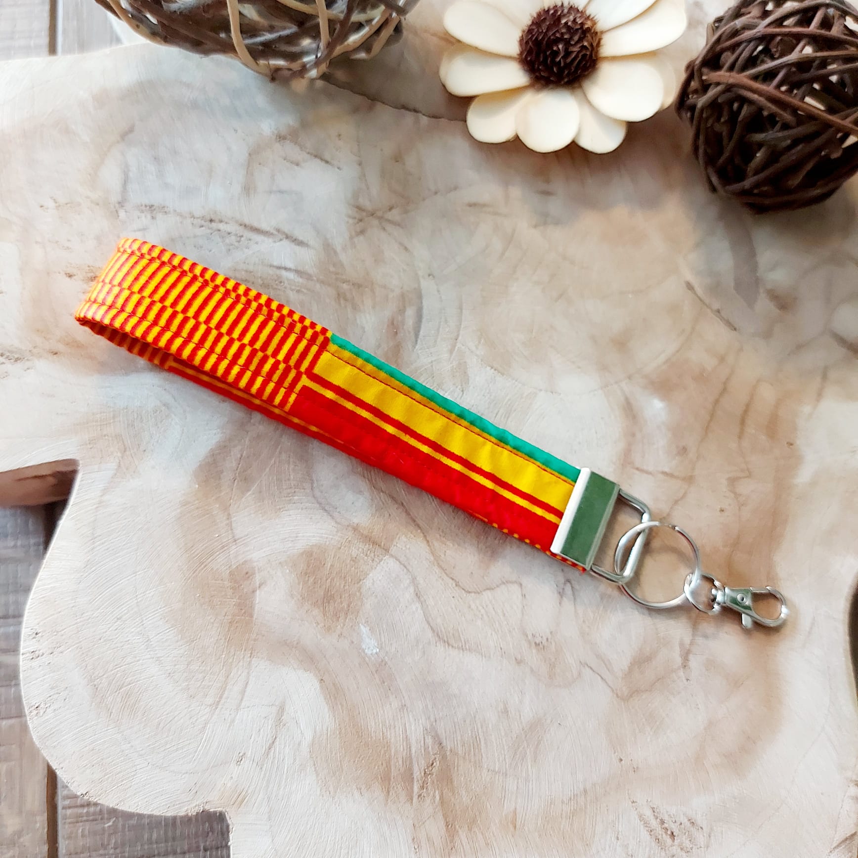 African Print and Leather Key Fob wristlet key holder featuring vibrant patterns and vegan leather lining, perfect for organizing keys.