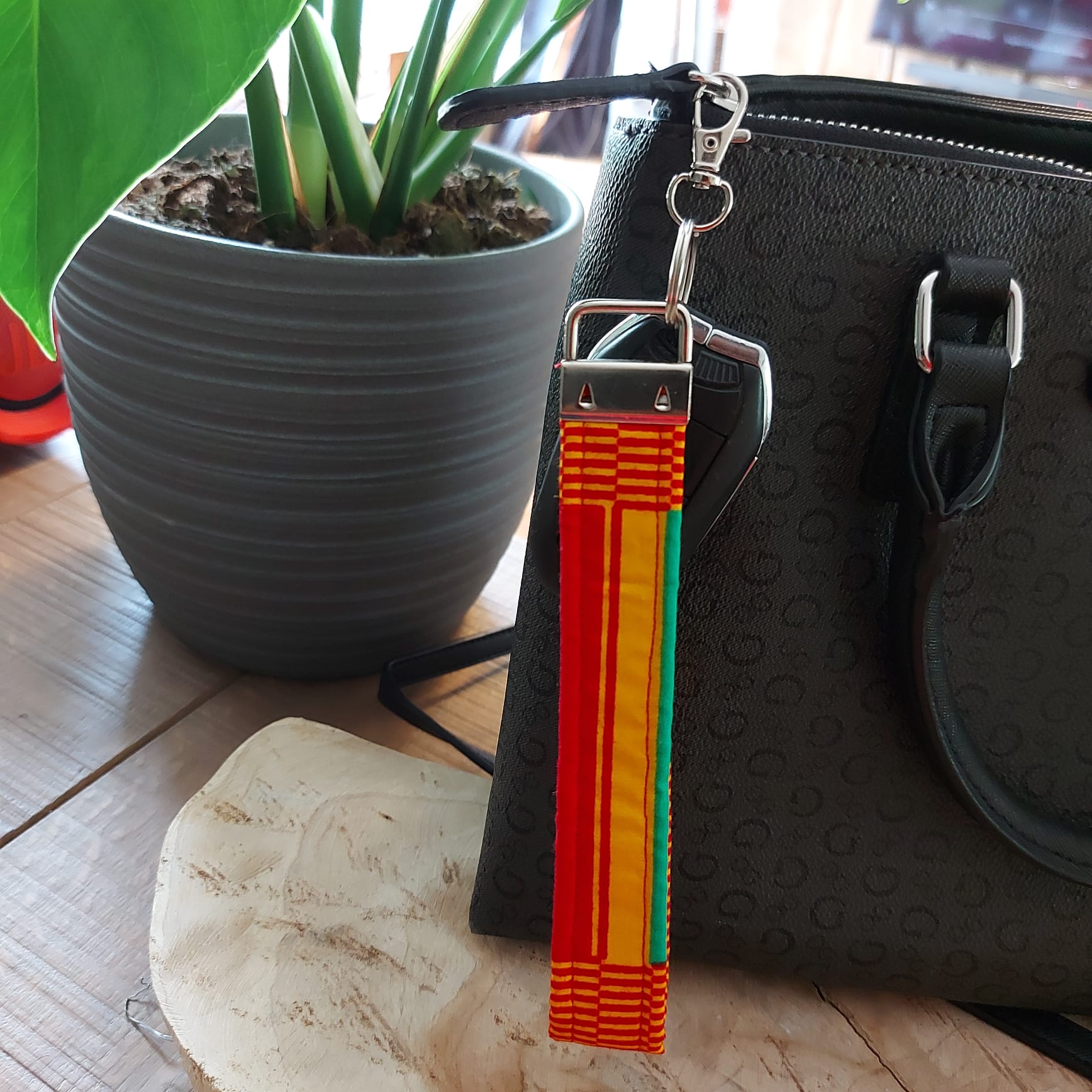 African Print and Leather Key Fob wristlet key holder featuring vibrant patterns and vegan leather lining, perfect for organizing keys.