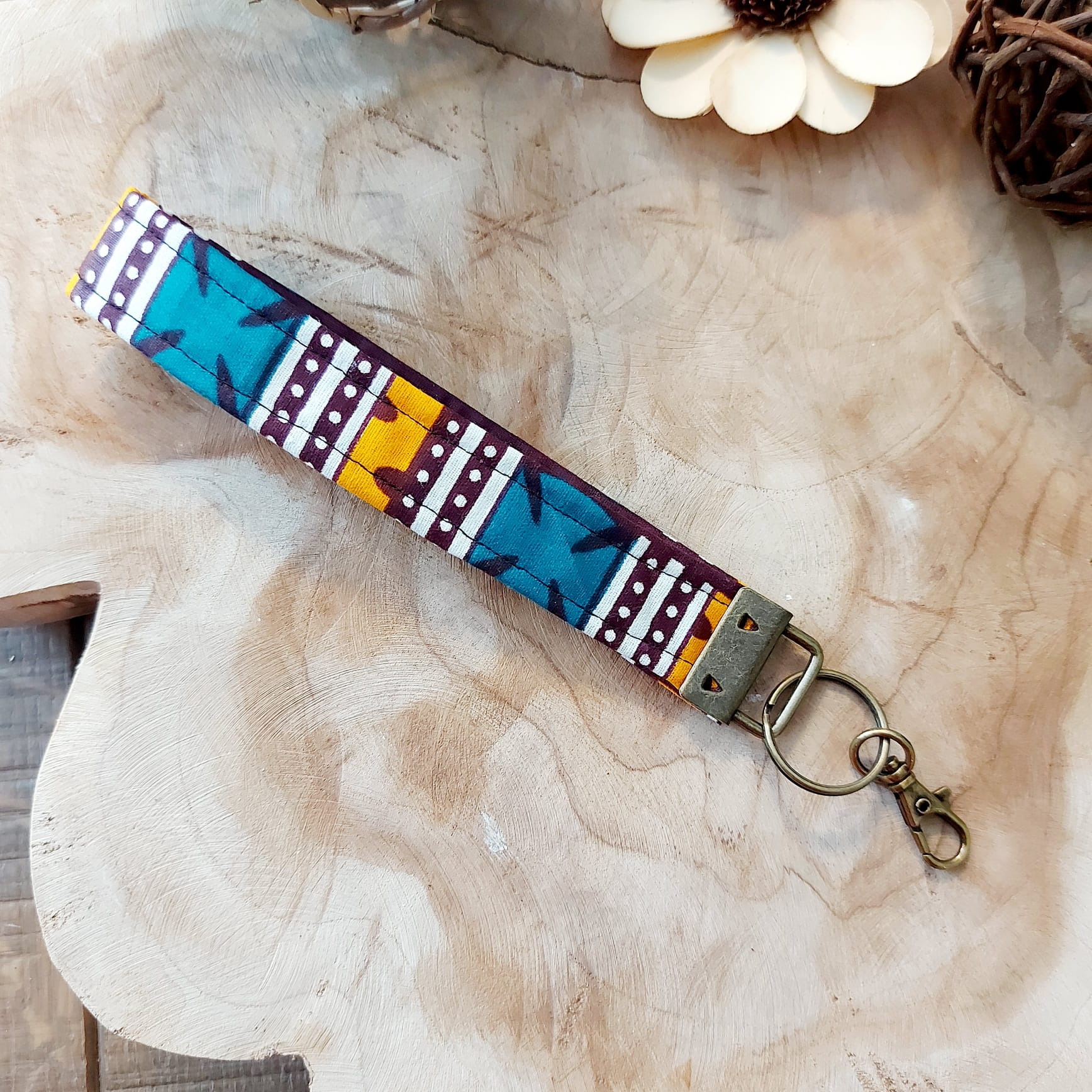 African Print and Leather Key Fob wristlet key holder featuring vibrant patterns and vegan leather lining, perfect for organizing keys.