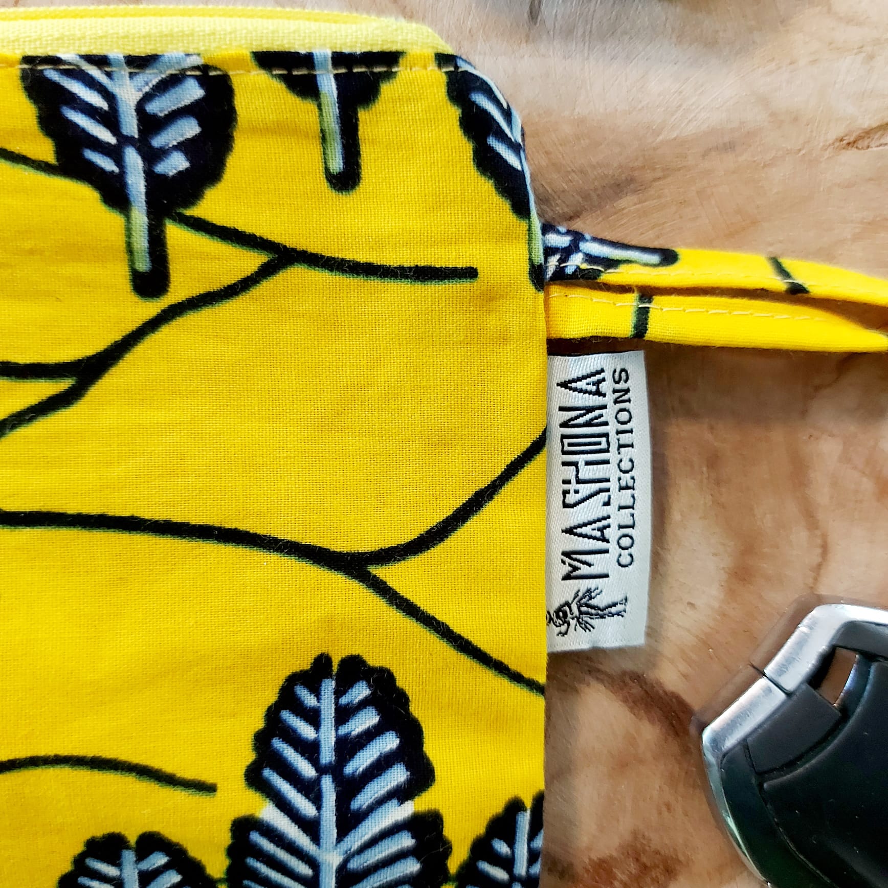 African Print Zipper Pouch made of vegan leather, featuring unique wax prints, perfect for make-up and stationery storage.