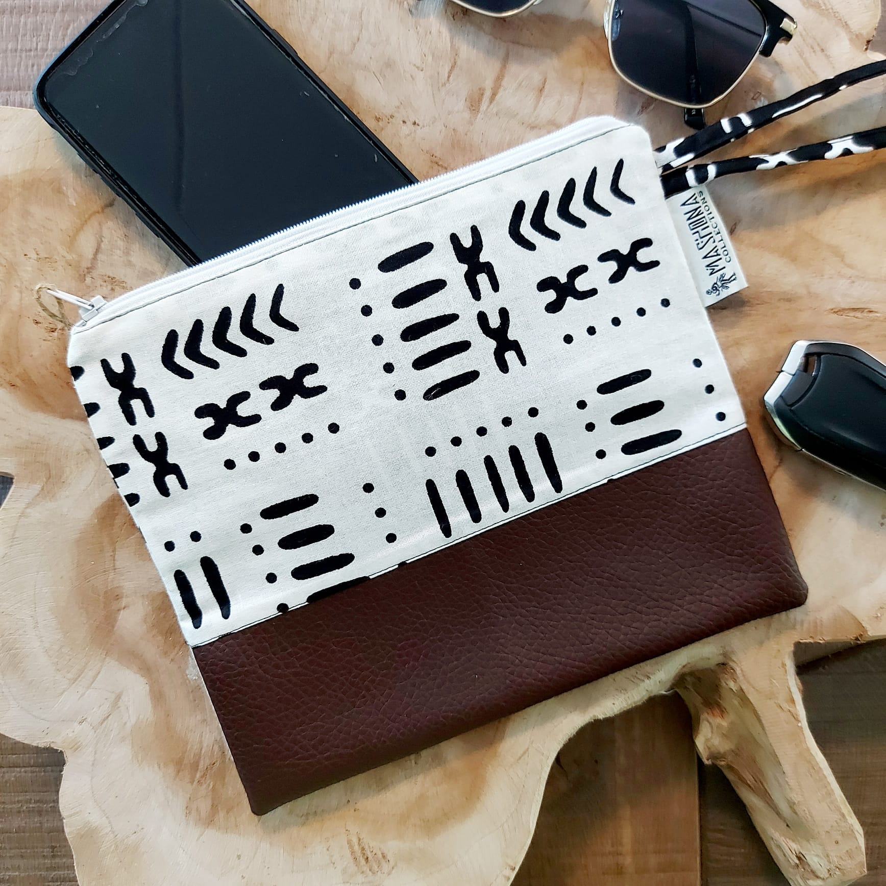 African Print Zipper Pouch made of vegan leather, featuring unique wax prints, perfect for make-up and stationery storage.