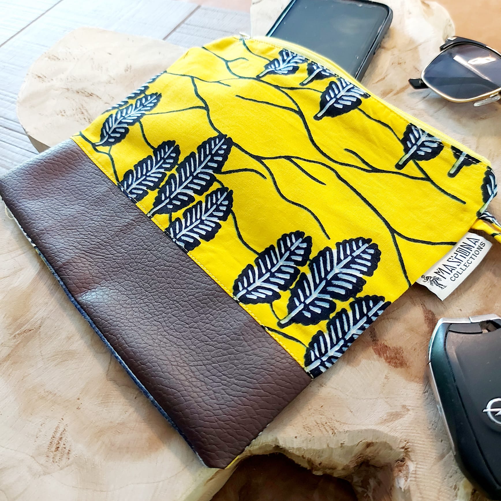 African Print Zipper Pouch made of vegan leather, featuring unique wax prints, perfect for make-up and stationery storage.