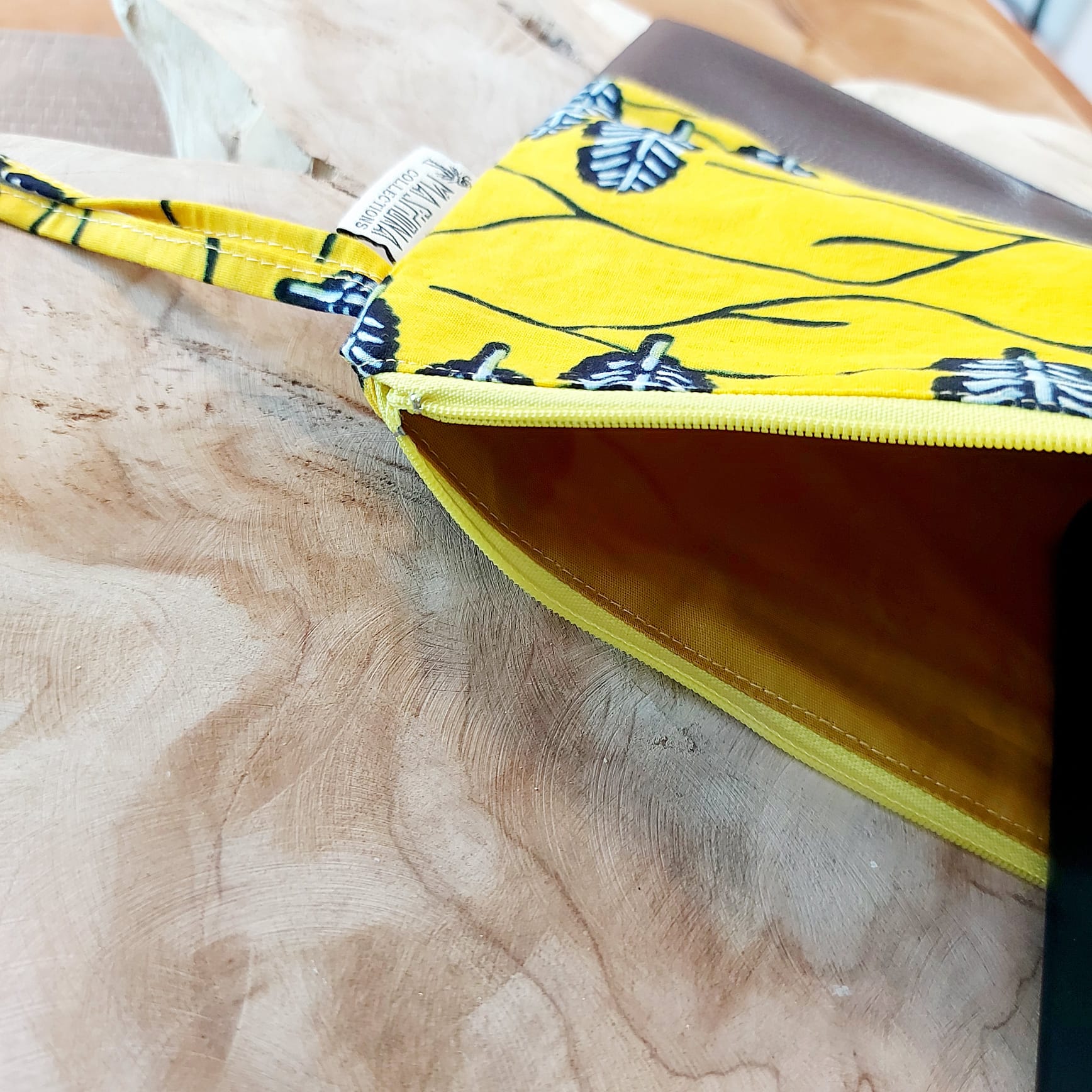 African Print Zipper Pouch made of vegan leather, featuring unique wax prints, perfect for make-up and stationery storage.