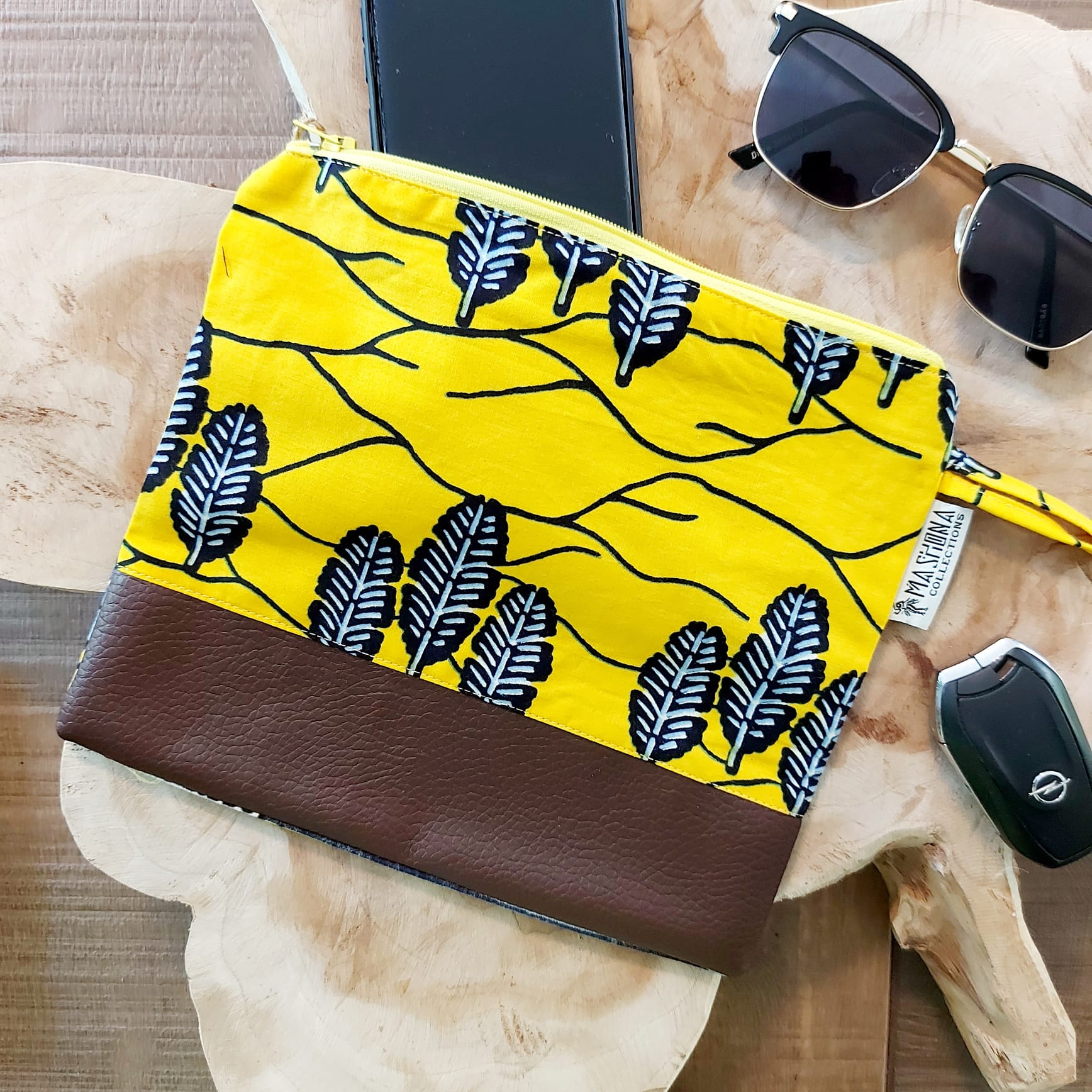 African Print Zipper Pouch made of vegan leather, featuring unique wax prints, perfect for make-up and stationery storage.