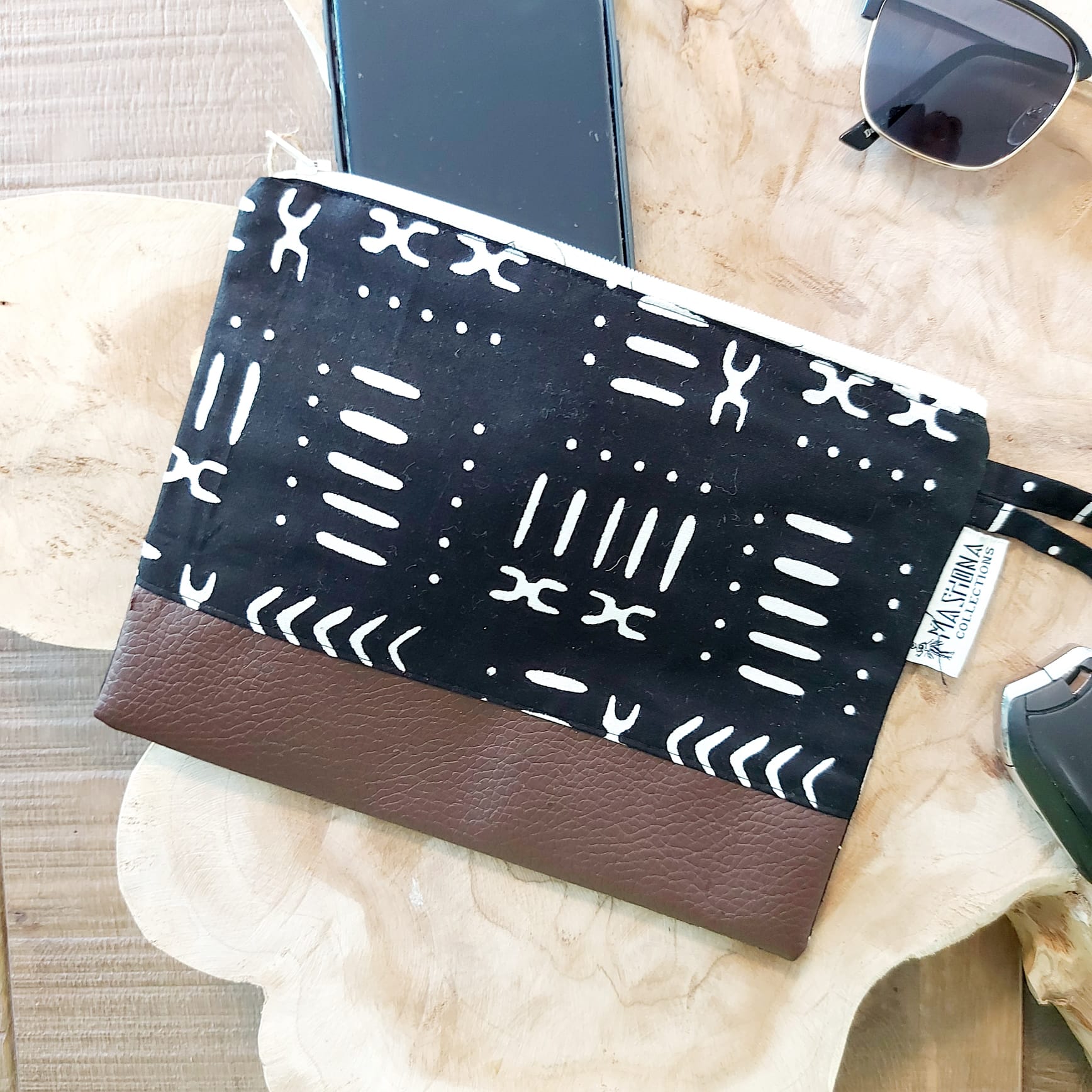 African Print Zipper Pouch made of vegan leather, featuring unique wax prints, perfect for make-up and stationery storage.