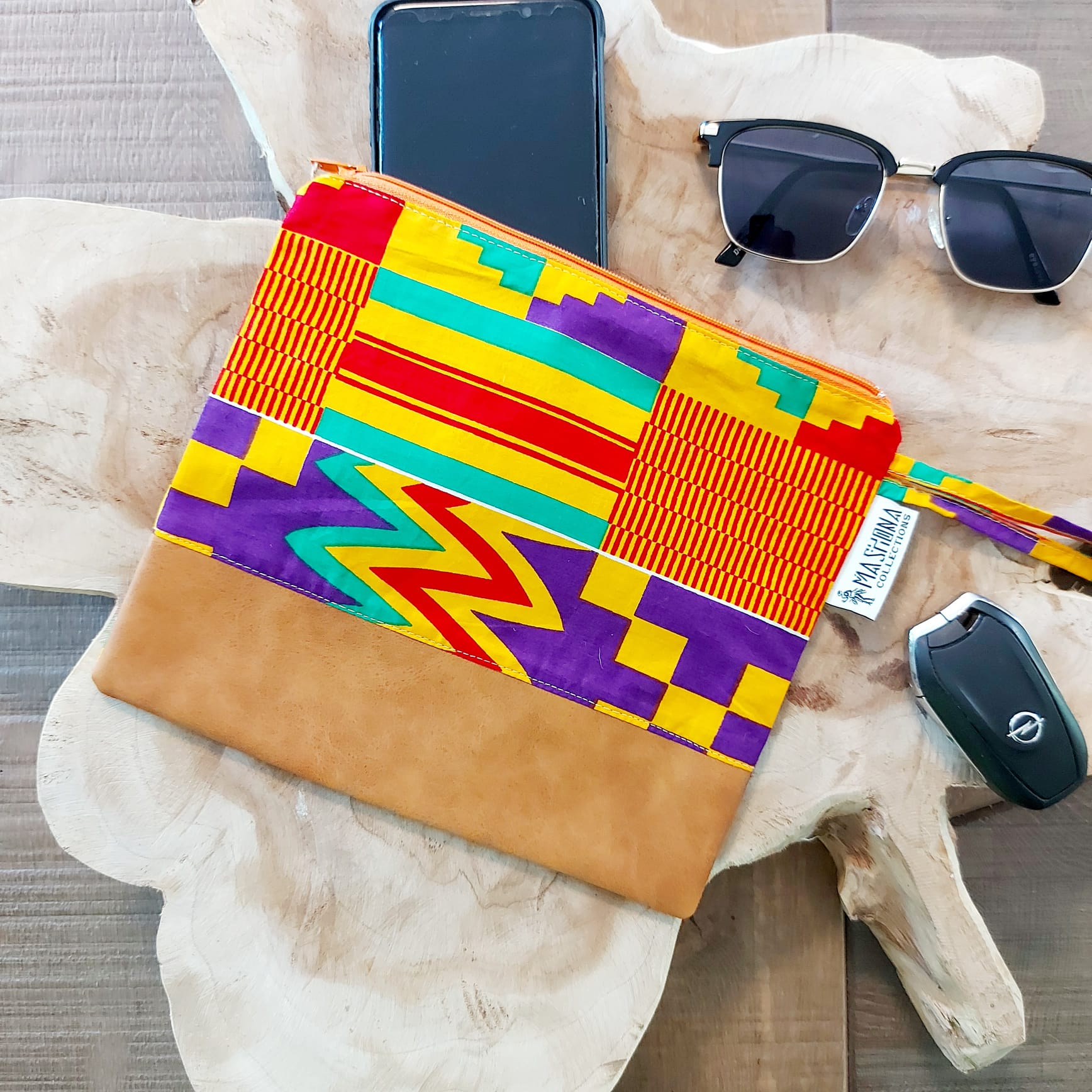 African Print Zipper Pouch made of vegan leather, featuring unique wax prints, perfect for make-up and stationery storage.