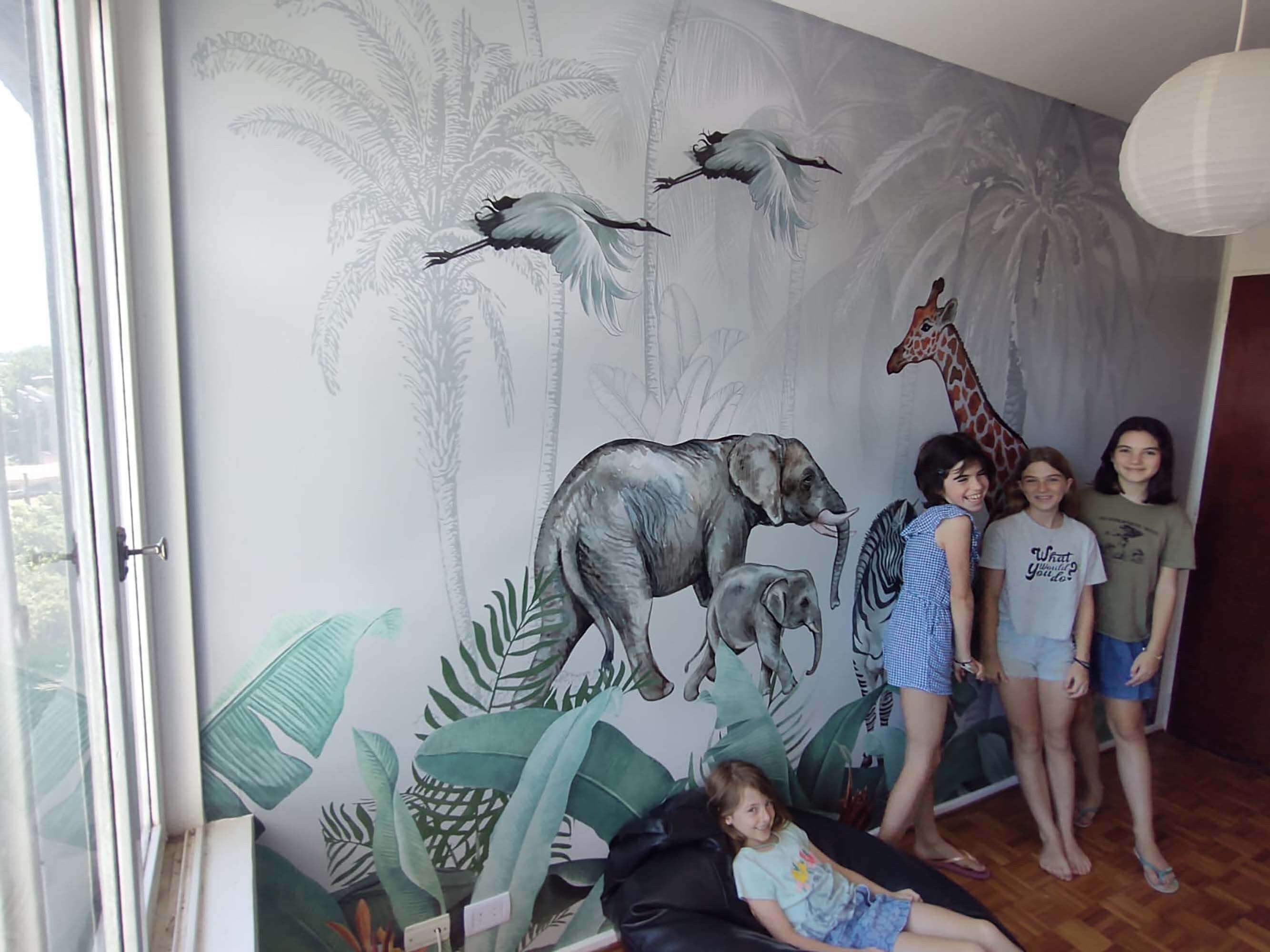 A vibrant African Safari Mural showcasing exotic wildlife in a lush savannah landscape, perfect for home decor.