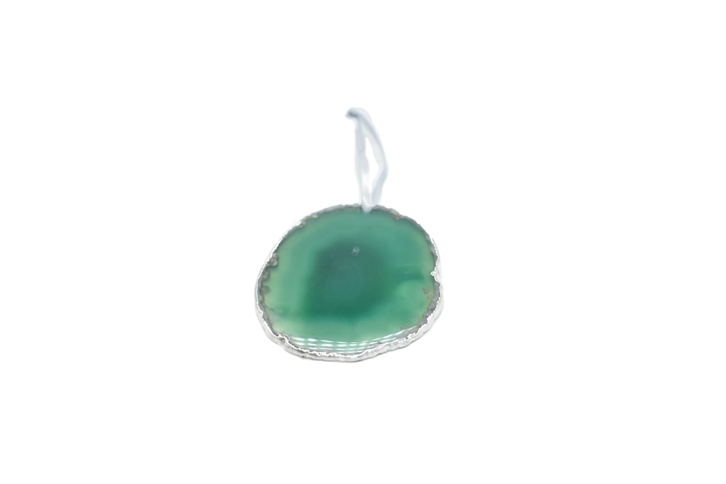 A beautiful agate ornament with silver electroplating, hanging from a silver silk ribbon, showcasing unique patterns and colors.