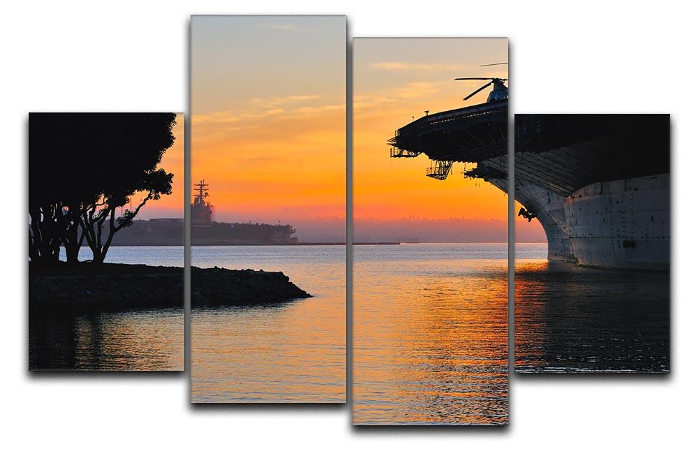 A beautiful 4-split canvas artwork depicting an aircraft carrier in a harbour during a vibrant sunset, showcasing rich colors and dynamic composition.