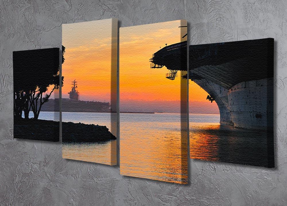 A beautiful 4-split canvas artwork depicting an aircraft carrier in a harbour during a vibrant sunset, showcasing rich colors and dynamic composition.